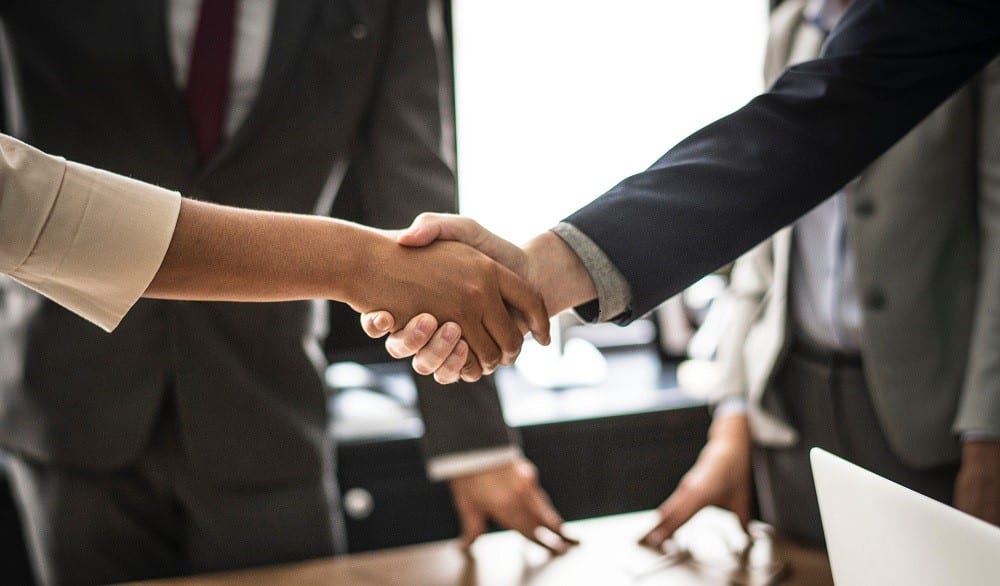 Man and woman sharing a handshake