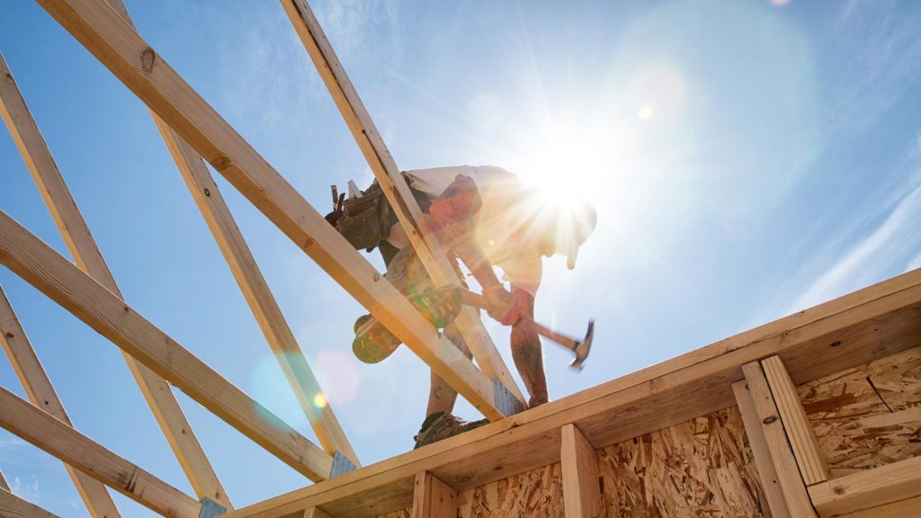Builder working on house