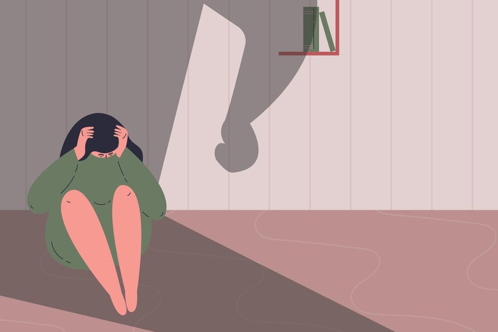 illustration of scared women sitting in corner with big shadow over her